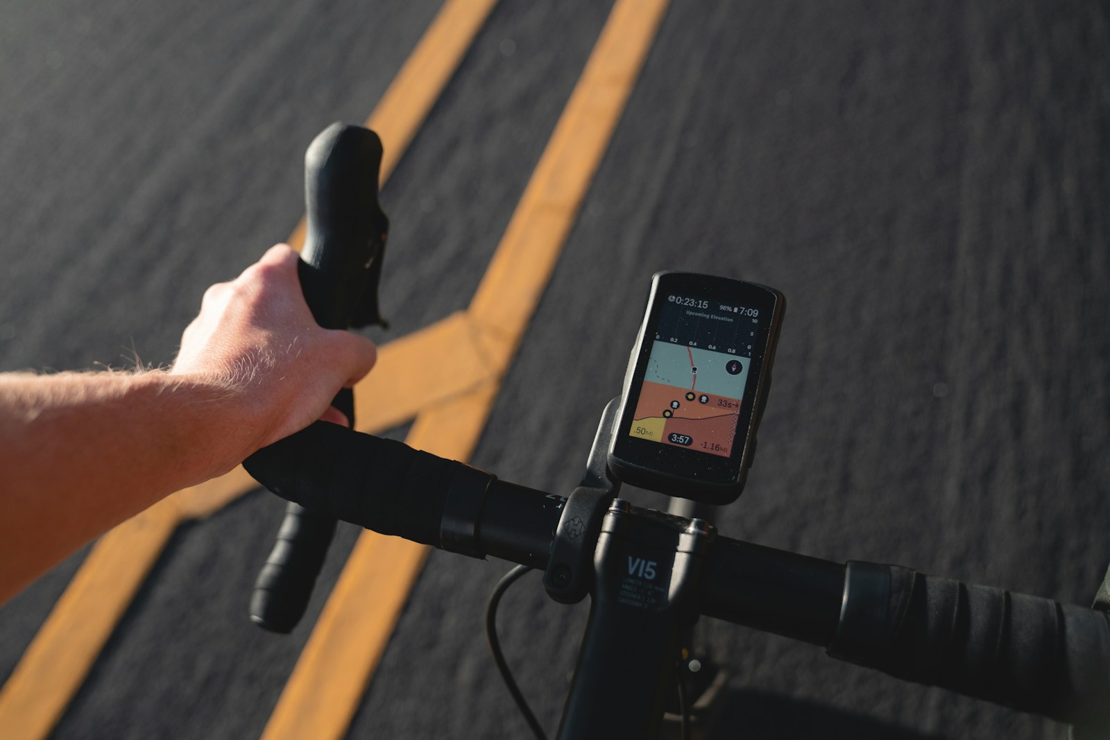 A rider following a route on a phone mounted to bicycle handlebars