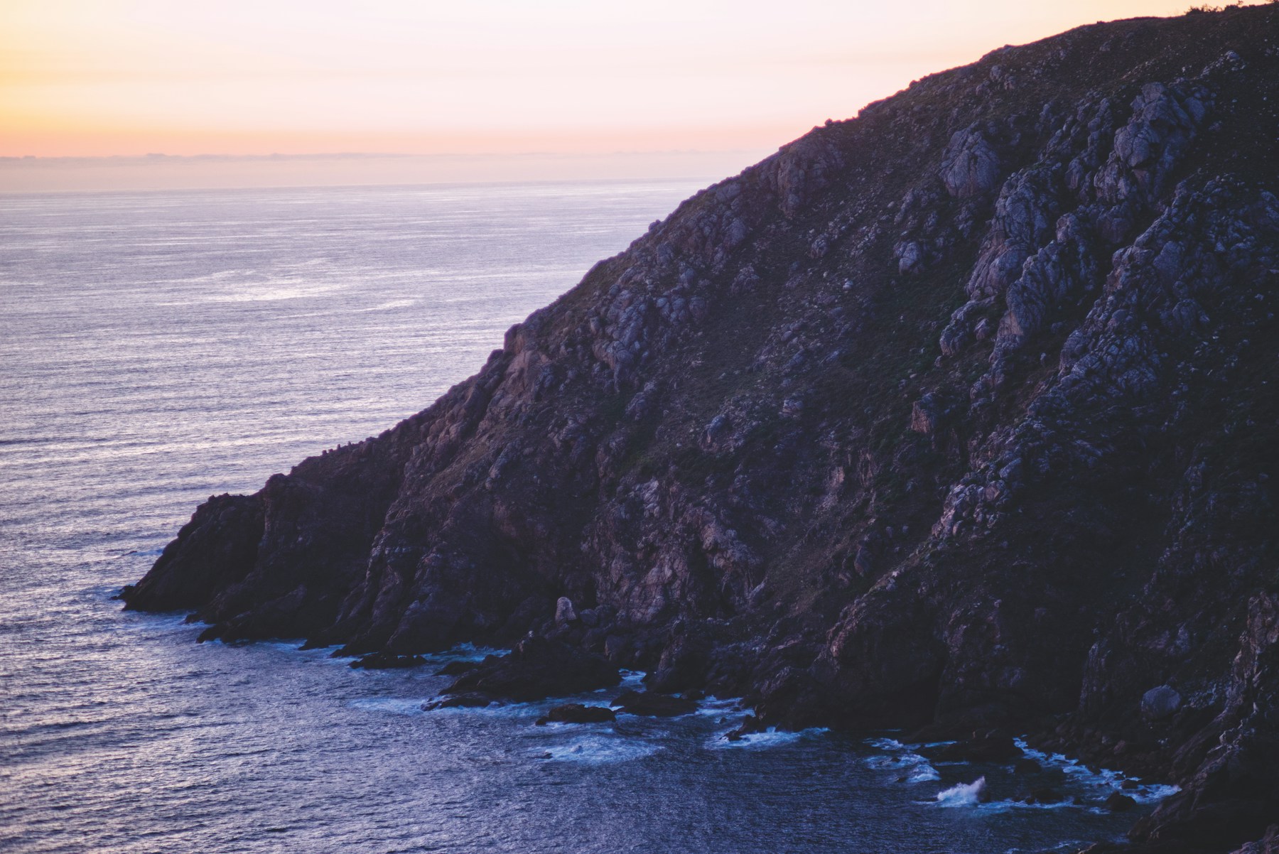 The rocky coast of Finisterre in Galicia at sunset
